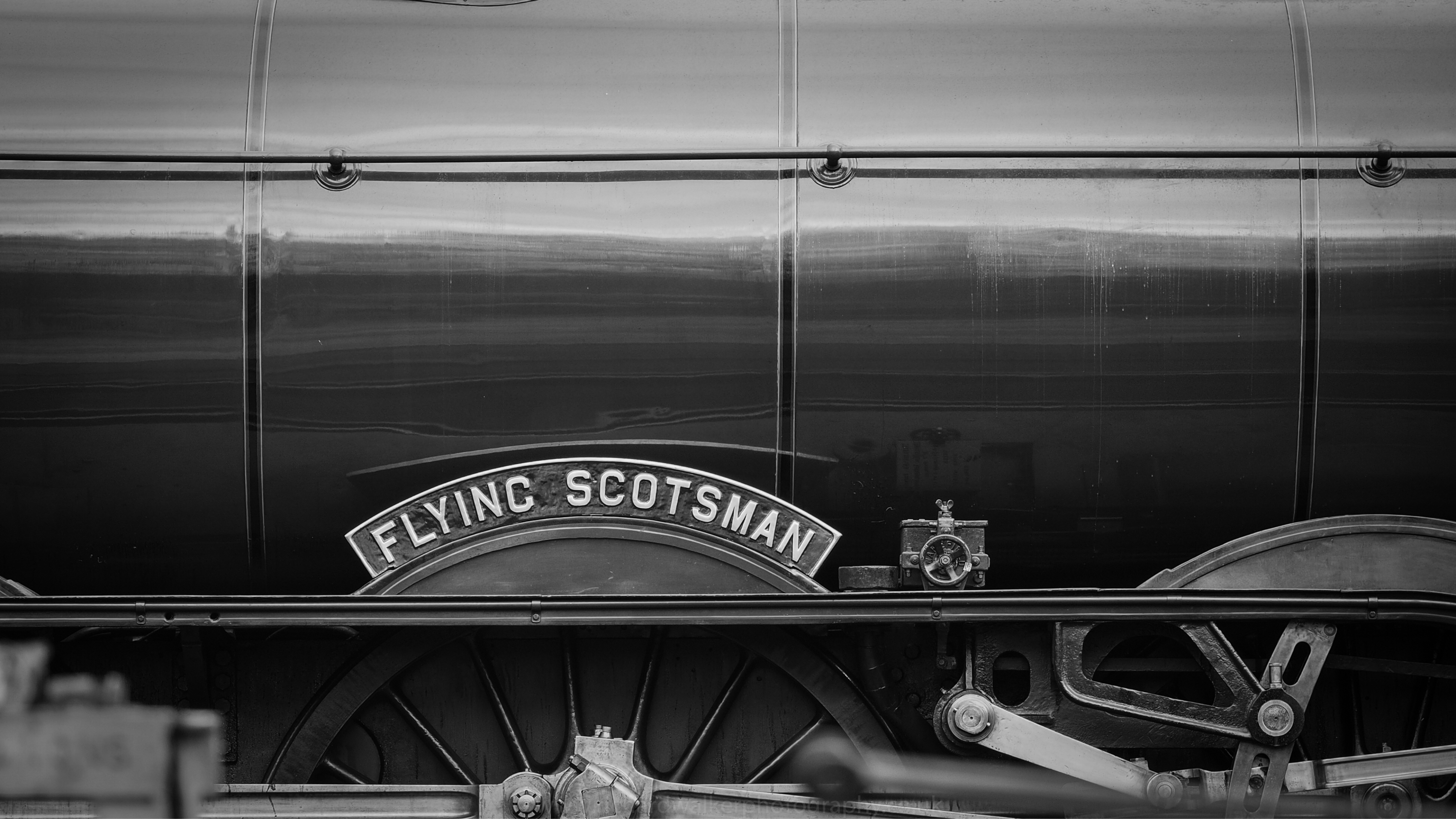 The Flying Scotsman nameplate in black and white