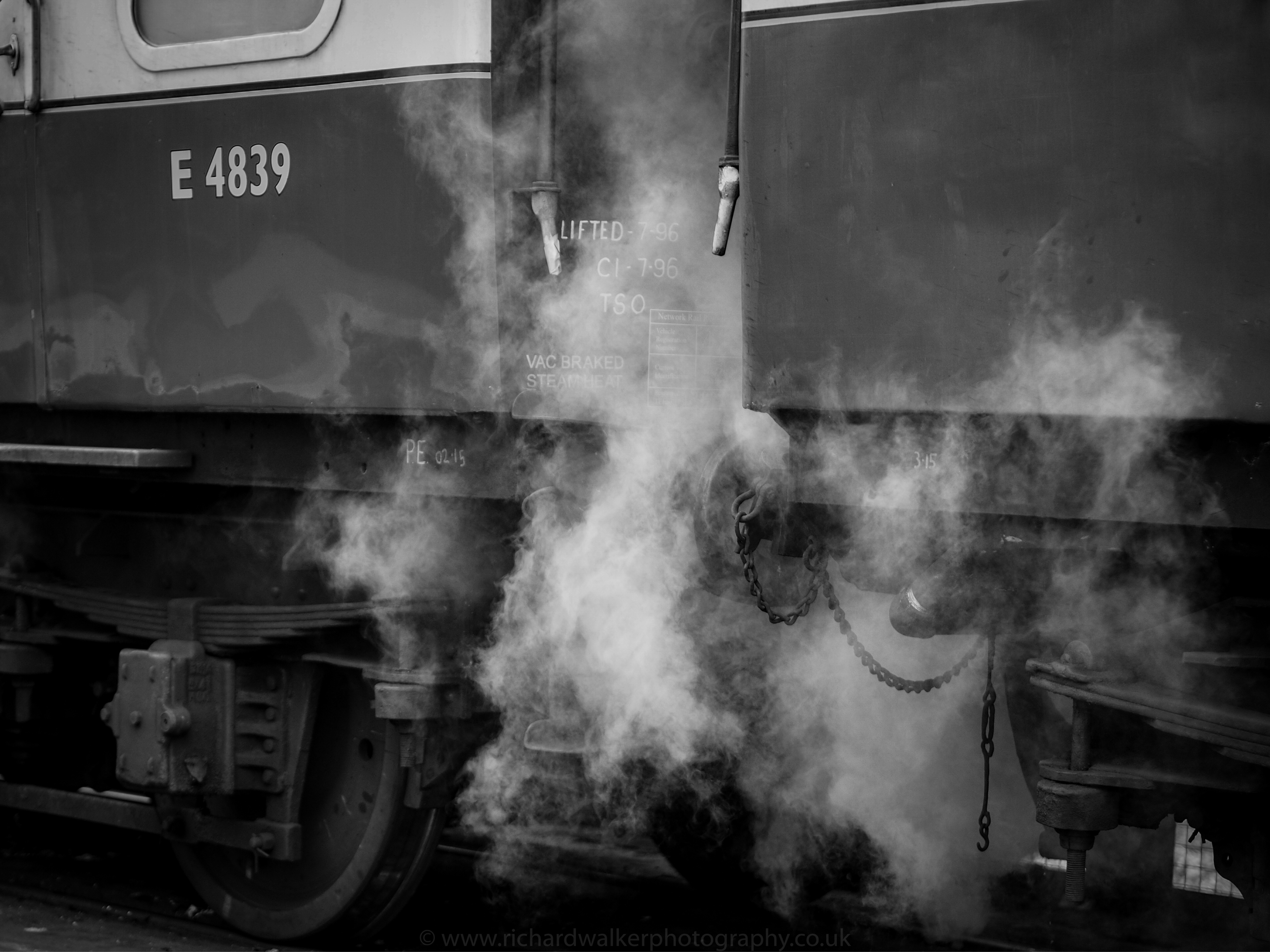 Steam pours from between the carriages of the Flying Scotsman at Pickering Station
