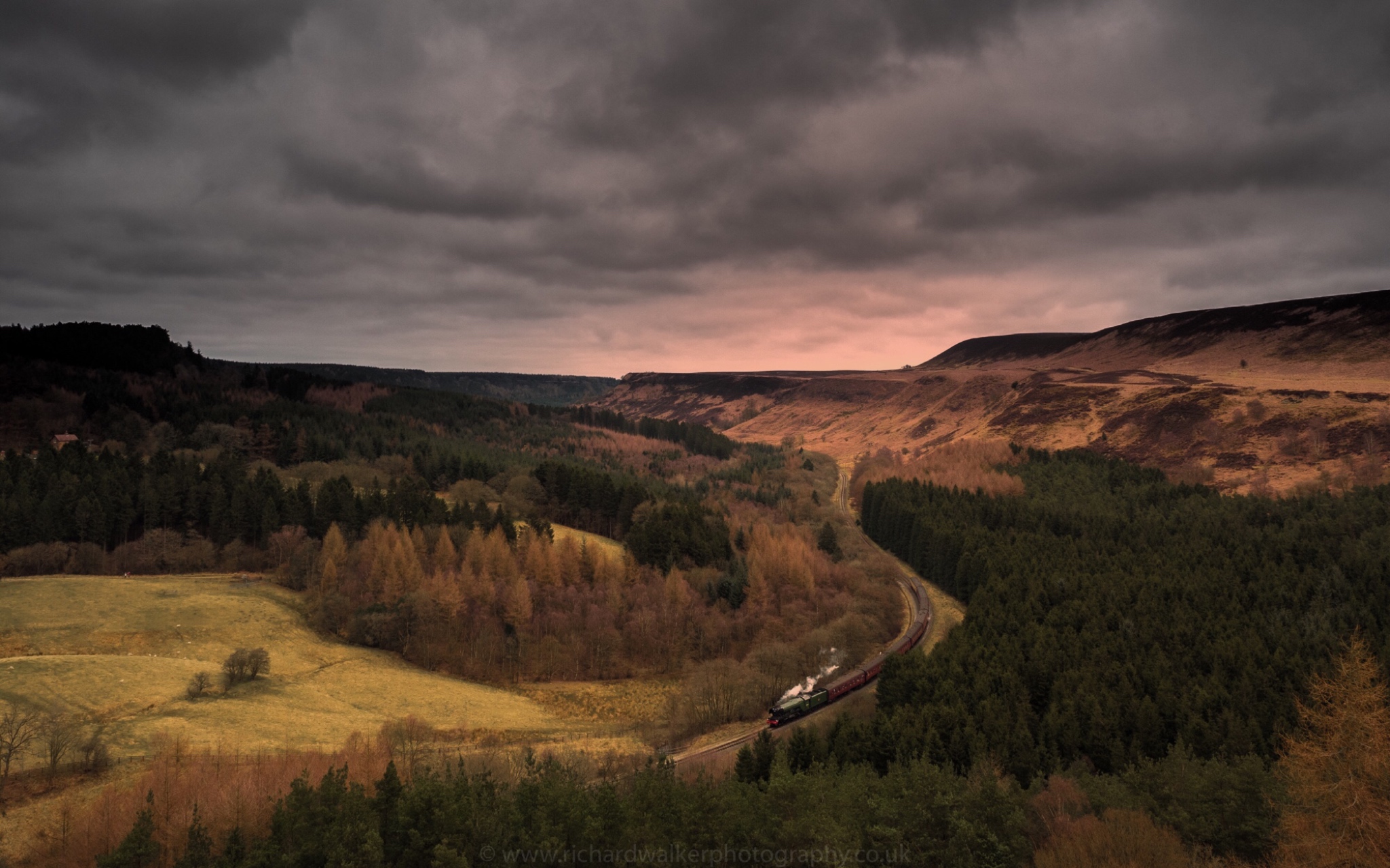 Flying Scotsman steams through a valley in the North York Moors